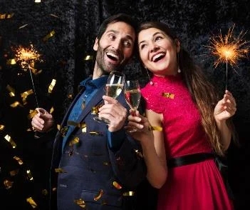 New Year's celebration in the mountains with couples and fireworks