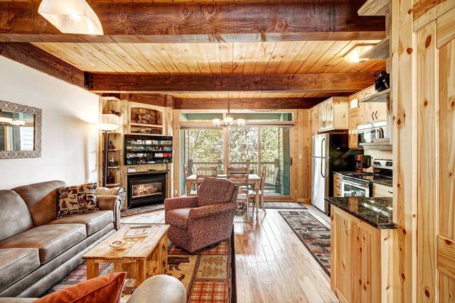 Cozy wood-beamed living room in a condo near Main Street