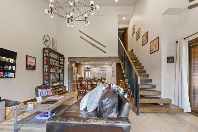 Open great room with a staircase in a large lodge