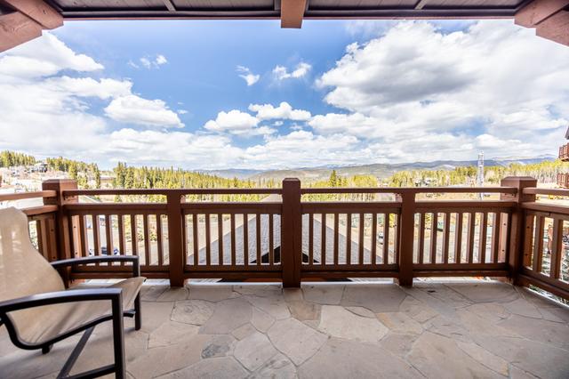 Deck with a wide mountain view at a ski-in, ski-out home