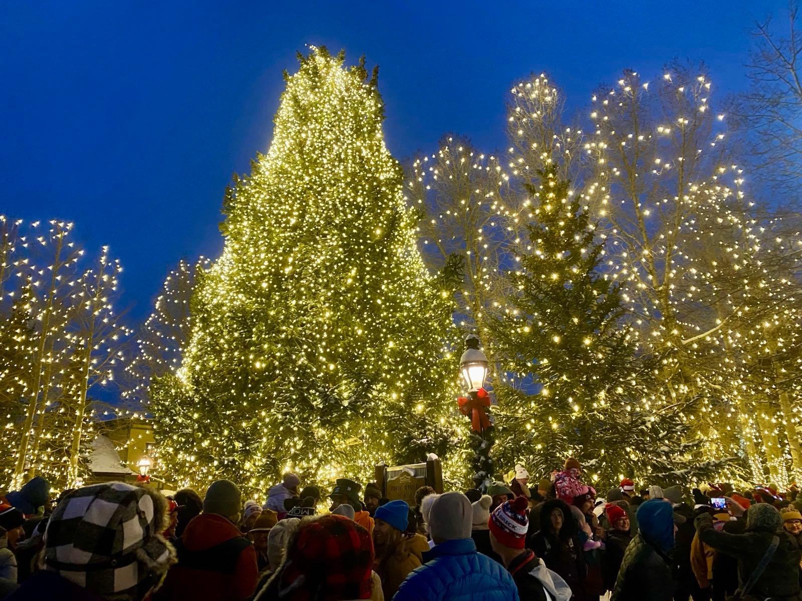 The town Christmas tree lit after dark at Blue River Plaza on Main Street, Breckenridge