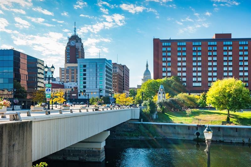 Downtown Lansing skyline over the Grand River, with the Capitol dome